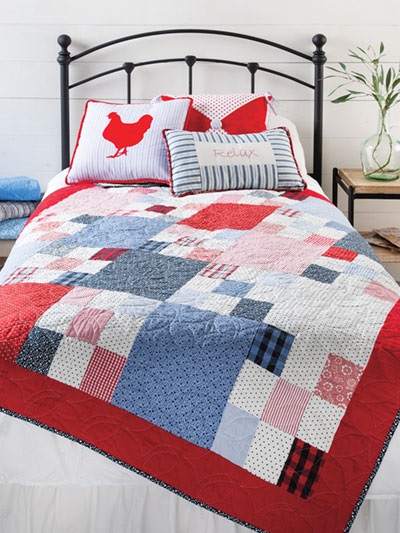 This bed quilt features an elongated nine-patch design that is simple but lovely. The patterns for making all of these delightful country-style quilting projects -- including the Wash Day quilt and the pillows -- are included in Farmhouse-Style Quilting, published by Annie's. 