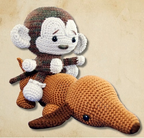 Marcel the Monkey Amigurumi toy riding on  Schnitzel the dachshund.  This picture is from the book called Voodoo Maggie’s Adorable Amigurumi, published by Tuttle Publishing.