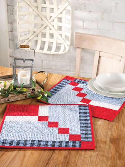 Need some new placemats? Want to make your own? The pattern for making these delightful placemats is included in Farmhouse-Style Quilting, published by Annie's. This design is an up-to-date variation of the traditional log cabin quilt block pattern.