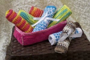 Crochet nursery box holding washcloths you can make for baby. These Projects Are All Included in Tunisian Crochet for Baby by Sharon Silverman