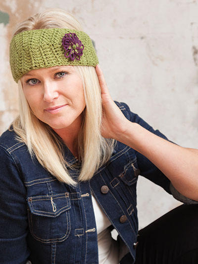 Cozy Crochet Ear Warmer Headband With Flower -- You'll find this crochet pattern and instructions for making its coordinating hand-loomed flower in the Flower Loom Crochet book byBeth Ham & Kristen Magnus, Published by Annie's Crochet