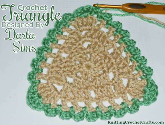 This pretty triangle features slightly-rounded corners and a scalloped edge. It’s a great choice for projects where a single triangle is desirable — for example, it would make a great coaster if crocheted using appropriate yarn.  This design is part of a pattern collection called Triangle Treasury.