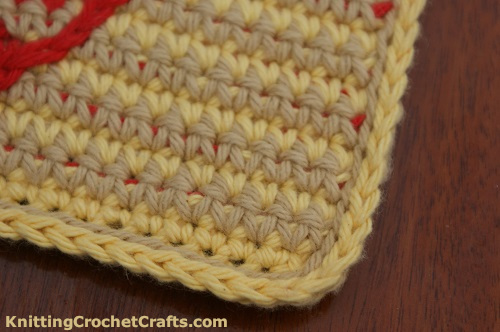 Close-Up Photo of the Edging Around the Striped Crochet Heart Potholder