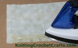 Sometimes it seems to me like sewing is more about pressing than it is about the actual sewing. Continue pressing the the seams on the lining for your checkered crochet pouch.