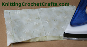 Continue pressing the seams on the lining for the checkered crochet pouch