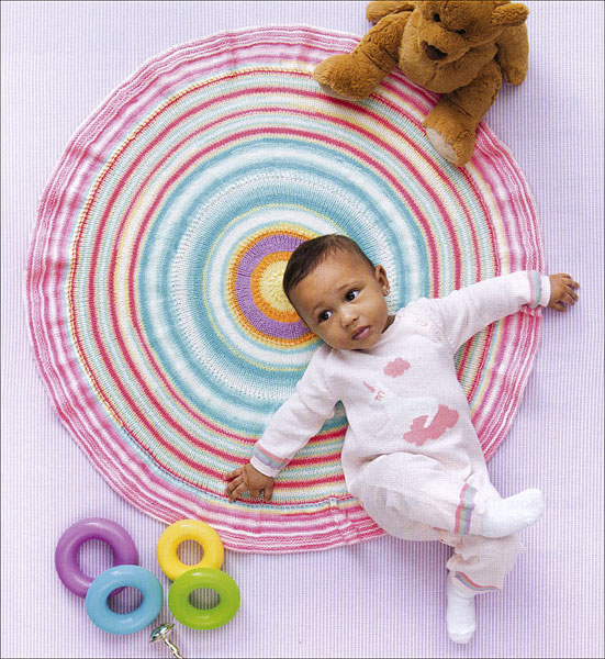Round Ruffled Baby Blanket Knitting Pattern -- This easy round baby blanket is an interesting project to knit. The pattern is published in the book Ice Cream Baby Afghans, published by Leisure Arts.