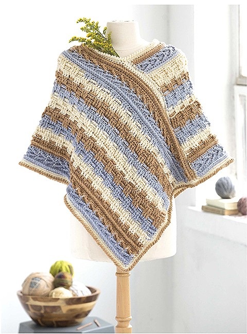 Aran crochet poncho pattern by Bonnie Barker, from the book Self-Striping Projects. This book is published by Leisure Arts.