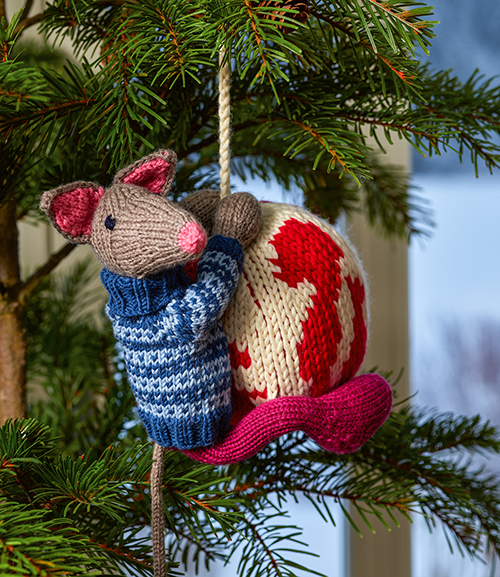 This cute toy mouse is named Magnus. You can knit him, along with bunches of different Christmas ornaments like the one you see pictured here, using patterns from the book called Arne & Carlos Favorite Designs, published by Trafalgar Square Books
