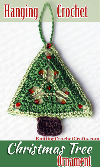 Hanging Crochet Christmas Tree Ornament: This ornament is made using a triangle motif pattern from a book called Crochet Kaleidoscope by Sandra Eng, published by Interweave. It's finished with sparkling red crystal beads. Crocheted and photographed by Amy Solovay.