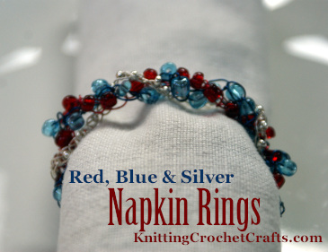 Red, Blue and Silver Beaded Napkin Rings With Rolled Cloth Napkin