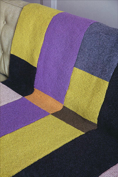 Modern Art Blanket Knitting Pattern: You can knit this sophisticated blanket using easy strips of garter stitch. Two lovely colorways are included in the book -- a brighter colorway, which you see pictured here, and a sophisticated monochromatic one. This pattern is included in Martin Storey's Afghan Knits. 
