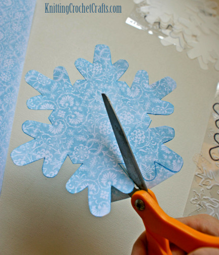 Cut Some Pieces of Patterned Paper in the Shape of Your Snowflake Album