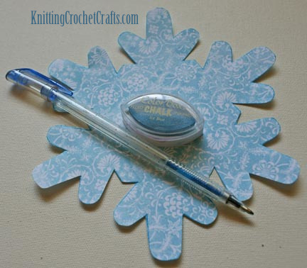 Patterned Paper Cut Into a Snowflake Shape Plus  Blue Glitter Gel Pen and Ice Blue Fluid Chalk