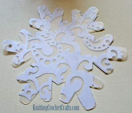 Frosty Lace Cardstock Adhered to the Snowflake-Shaped Album Page