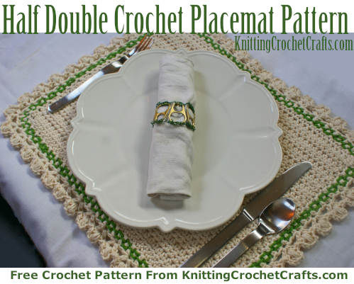 Half Double Crochet Placemat Pattern: Pictured here is the half double crochet placemat with a lacy edging. I've styled this placemat with a plate and place setting so you can get an idea of how big it turns out. On top of the plate is a cloth napkin placed inside an upcycled napkin ring; you can get the free patterns for both the placemat and the napkin ring here on our website.