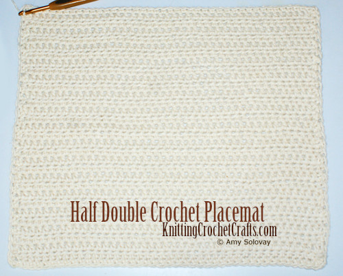 Half Double Crochet Placemat: This picture shows you how the placemat looks before adding any edgings. You have multiple choices for edgings you can choose to complete your placemat -- or you can just keep it simple and end off your placemats without adding any edging at all. If you like the minimalist aesthetic, you might not want to finish your placemats with an edging.