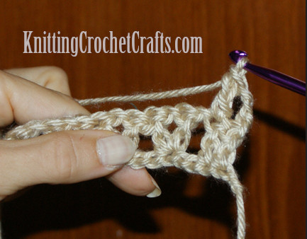 Your turning chain will count as the first double crochet stitch in the row, so there is no need to work another stitch in the first stitch. You'll work a double crochet stitch into the next double crochet.
