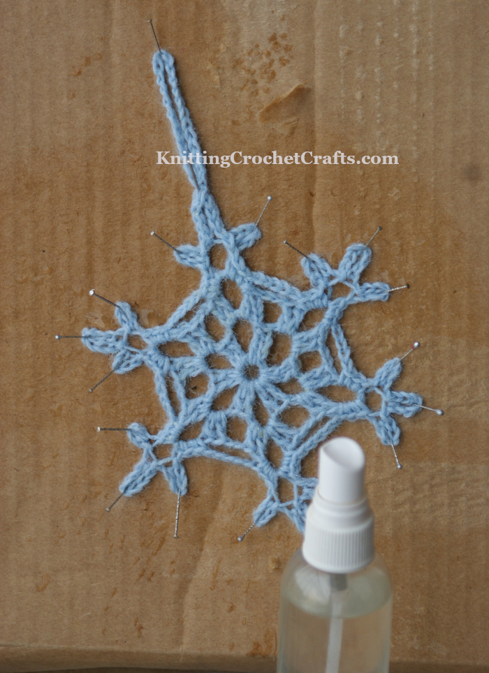 How to Block a Crocheted Snowflake: Pin the Snowflake to Cardboard and Wet It; Then Allow It to Air Dry.
