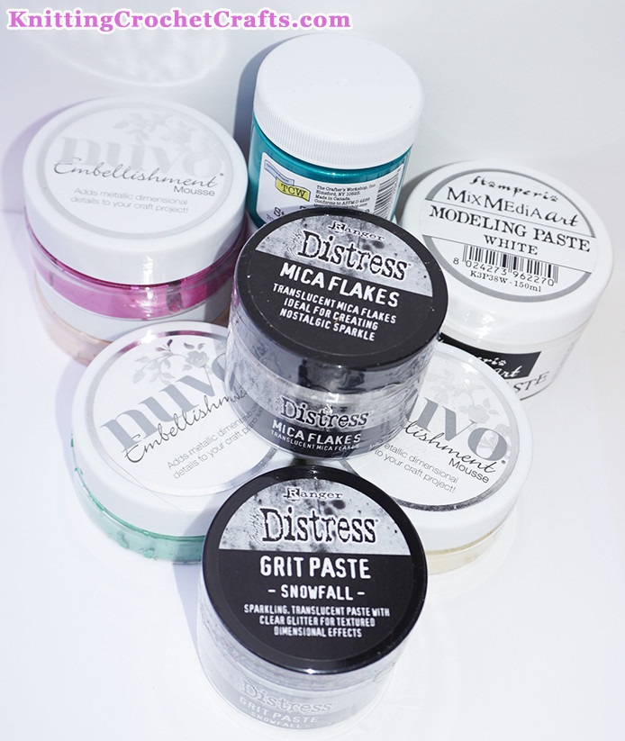 Mixed Media Art Supplies: Stencil Butter by the Crafter's Workshop; Embellishment Mousse by Nuvo; Modeling Paste by Stamperia; Distress Mica Flakes by Tim Holtz; and Distress Grit Paste / Snowfall by Tim Holtz