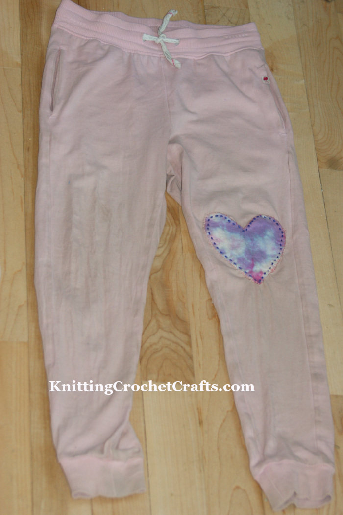 Child's Pants Mended With a Handmade, Tie-Dyed, Heart-Shaped Patch