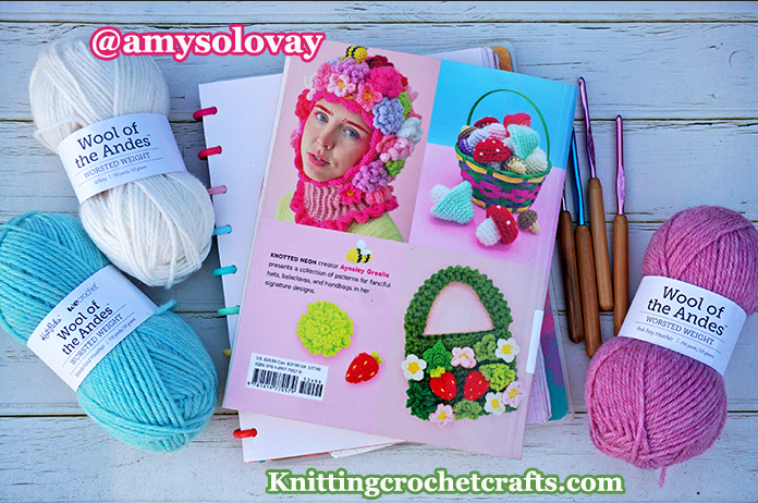 The Back Cover of the Mad Hatter Crochet Book by Aynsley Grealis, Pictured With Silvalume Crochet Hooks and Wool of the Andes Worsted Weight Wool Yarn