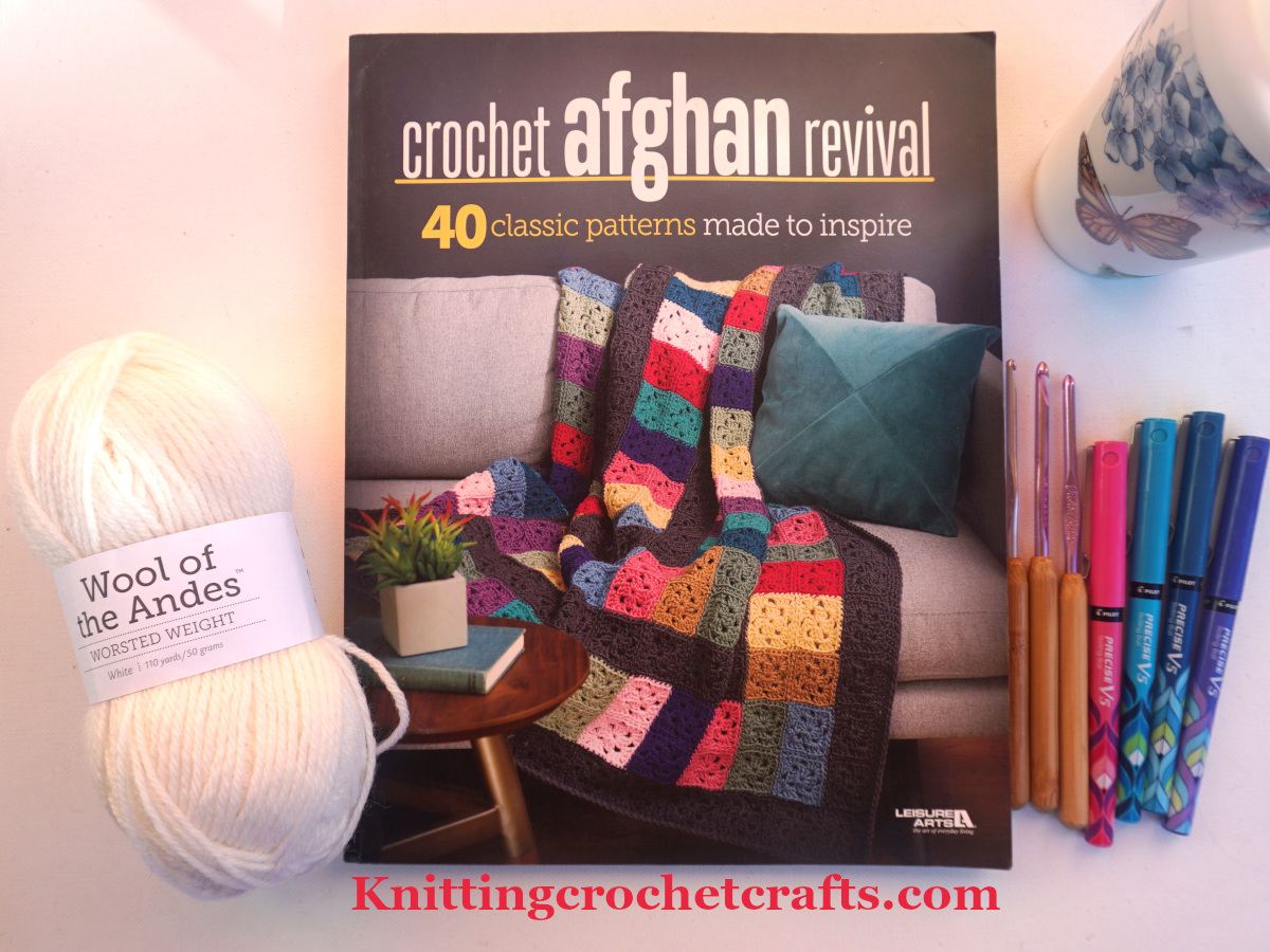 Crochet Afghan Revival Book Published by Leisure Arts - Pictured with craft supplies including white Wool of the Andes yarn by Knit Picks, Susan Bates Bamboo Handled Crochet Hooks and Pilot pens.