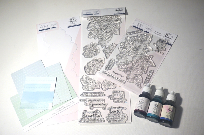 Paper Craft Supplies by Pinkfresh Studio: Life Is Good Stamp Set; Joyful Bouquet Stamp Set; Layered Clouds Slim Stencil; Regal Kiss Reinker; Mermaid Cove Reinker; Blue Jay Reinker; and Paper Scraps