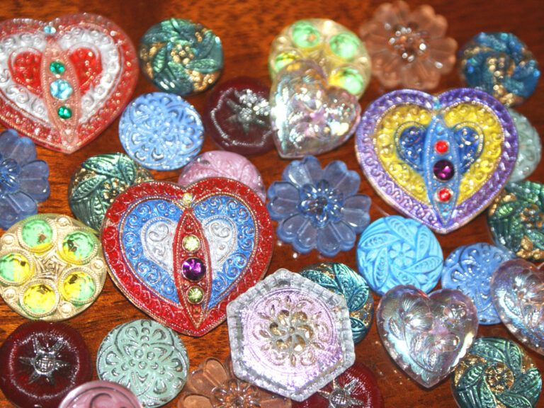 What can you do with buttons? Many people have oddball buttons hanging around in their junk drawers or tucked away in old canning jars. If you have any oddball buttons, vintage buttons, fancy buttons or Czech glass buttons in your stash, perhaps you need ideas for what to do with them. Check out our button craft ideas to find suggestions.